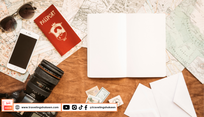 Traveler holding passport, boarding pass, and other essential documents for international travel